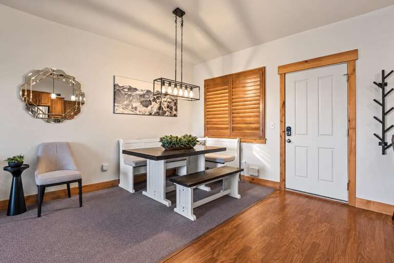 Step into your welcoming space where warm wood accents and mountain charm greet you right at the door, creating a cozy retreat for your mountain getaway.