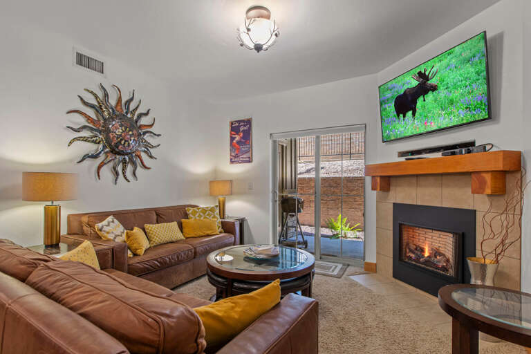 Vacation Rentals in Park City at Bear Hollow Lodges 4205 Living room with gas fireplace and patio access Vacation Rentals in Park City at Bear Hollow Lodges 4205 Living room with gas fireplace and patio access