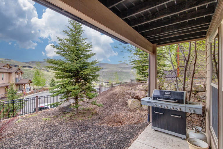 A private outdoor space offering mountain views and a ready-to-use grill for easy meals under the open sky.