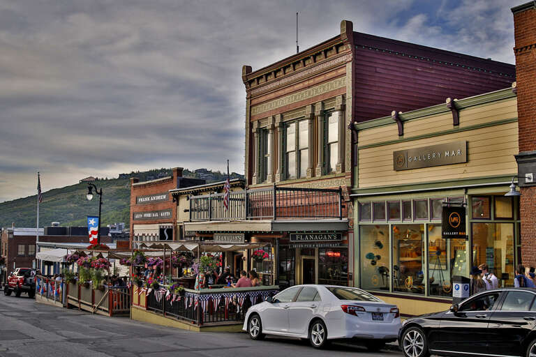 Historic downtown district features charming storefronts, local restaurants, and boutique galleries nestled in a scenic mountain valley setting.