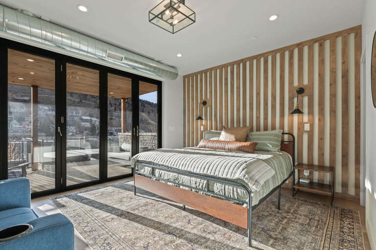 King Suite: Patio access and cozy sofa chair.