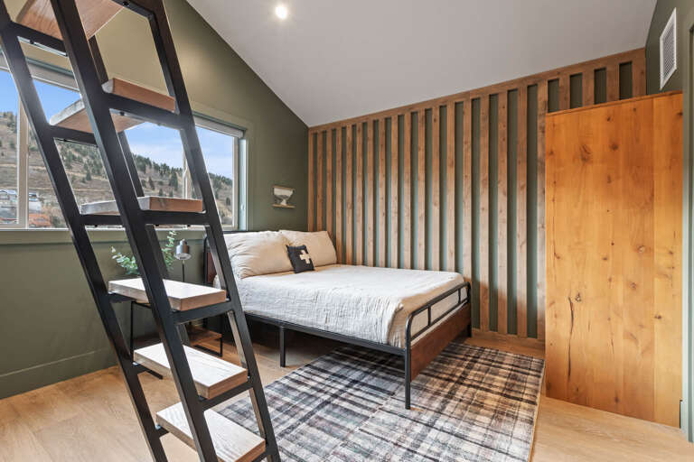 Queen Bed, Overhead Window Triple Bunk Bed: Cozy sleeping with a view