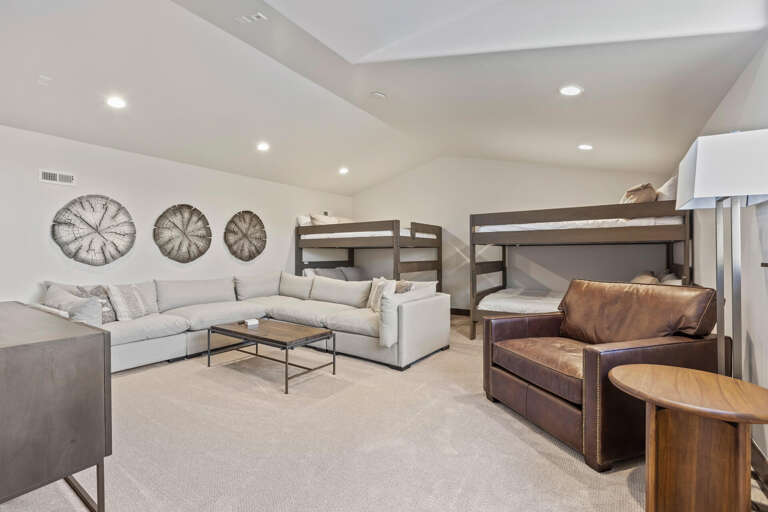 Unwind in your spacious retreat where modern comfort meets thoughtful design. Plush seating invites relaxation while bunk beds provide flexible sleeping arrangements for your whole group.