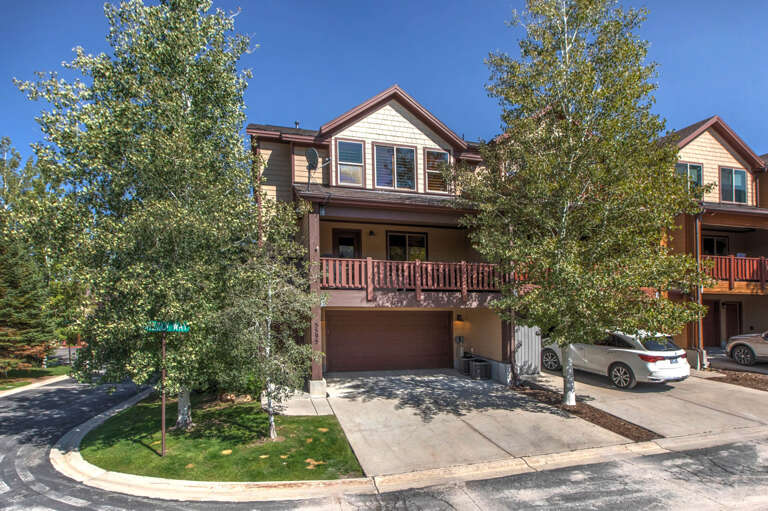 This well-maintained multi-level townhome features mature trees and convenient garage parking in a quiet residential neighborhood, offering comfortable mountain living with easy access.