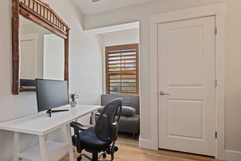 Bear Hollow Village 5595: Cozy setup with a desk, sofa, and a sleek monitor. Bear Hollow Village 5595: Cozy setup with a desk, sofa, and a sleek monitor.