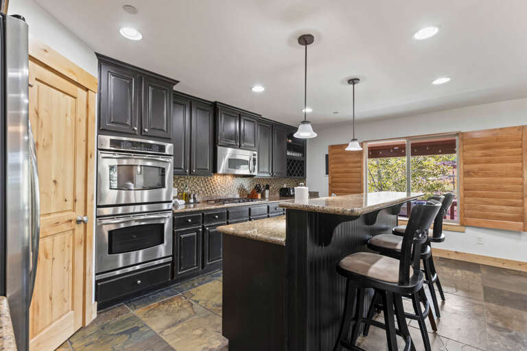 Bear Hollow Village 5595: Fully Equipped Kitchen: Appliances with bar stools, perfect for cooking and dining. Bear Hollow Village 5595: Fully Equipped Kitchen: Appliances with bar stools, perfect for cooking and dining.