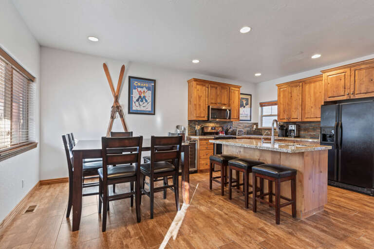 Bear Hollow 5482: Gather around the dining table with sleek bar stools nearby.