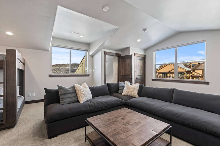 Black Rock Ridge 14536: Cozy space with a stylish sofa, center table, and natural light. Black Rock Ridge 14536: Cozy space with a stylish sofa, center table, and natural light.
