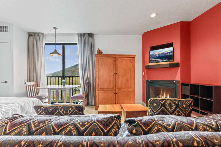 Stillwater Lodge 3005: Cozy ambiance with a sofa set, center table, and fireplace." Stillwater Lodge 3005: Cozy ambiance with a sofa set, center table, and fireplace."