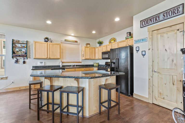 Bear Hollow Village 5426:  An extra-large center island in the nearby, fully equipped kitchen has bar stool seating for four and an adjacent table for six. Bear Hollow Village 5426:  An extra-large center island in the nearby, fully equipped kitchen has bar stool seating for four and an adjacent table for six.