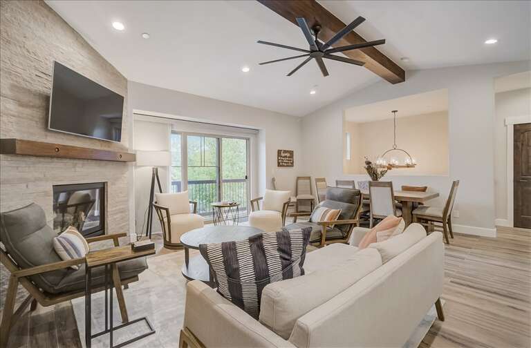 Black Rock Ridge 14202:  Living Room: "Cozy corner with fireplace, TV, and balcony view through sliding door." Black Rock Ridge 14202:  Living Room: "Cozy corner with fireplace, TV, and balcony view through sliding door."