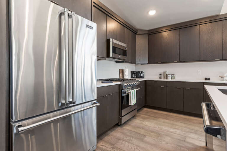 Mayflower Lakeside 301-45: Modern appliances and ample storage in sleek kitchen design.