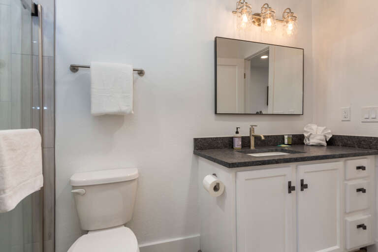Cozy bathroom with sink, mirror, and cabinet under the sink. Cozy bathroom with sink, mirror, and cabinet under the sink.