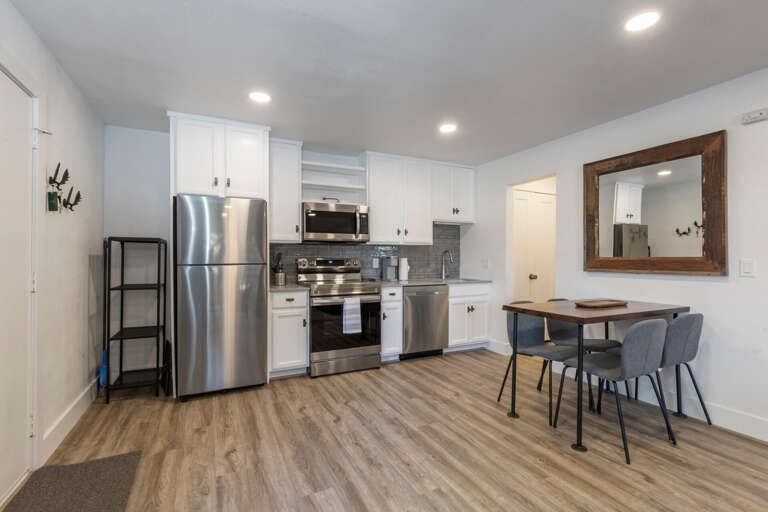 Cozy dining setup for four, perfect for family meals. Cozy dining setup for four, perfect for family meals.