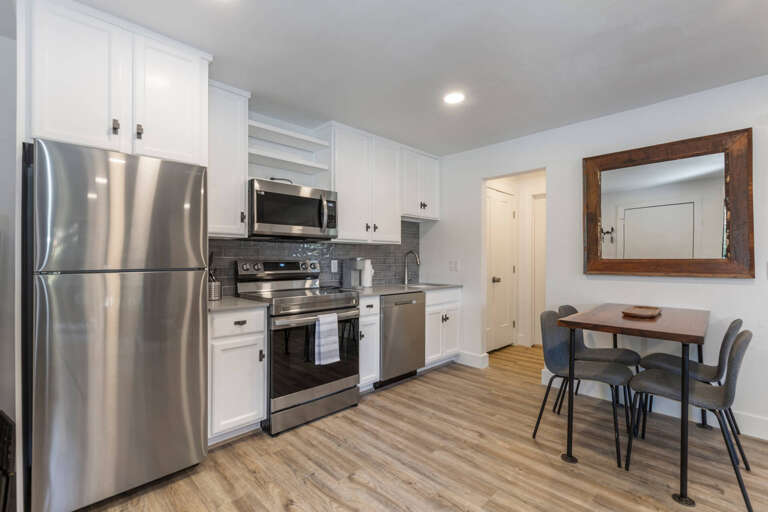 Cozy dining setup for four, perfect for family meals. Cozy dining setup for four, perfect for family meals.