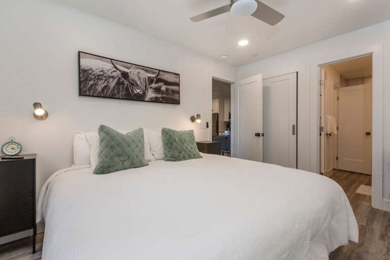 Serene king bed by the window. Serene king bed by the window.