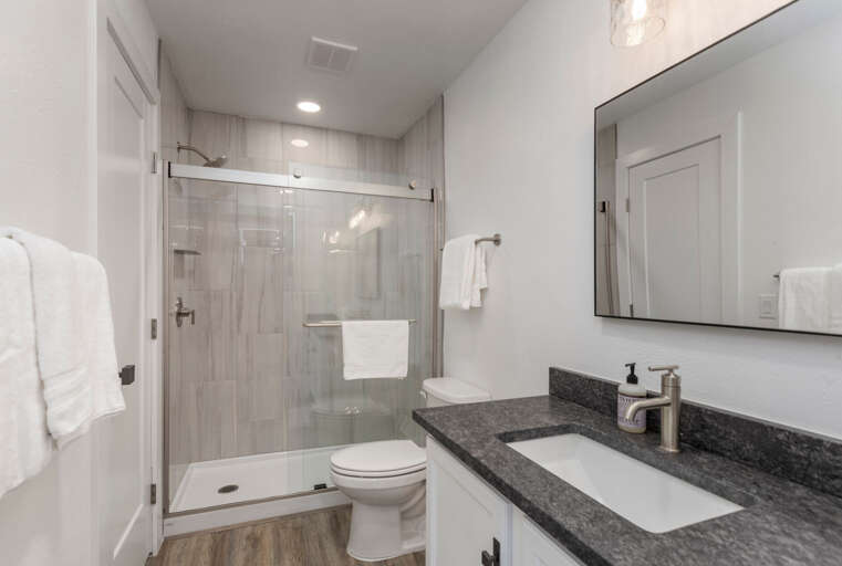 Serene king bed by the window. Serene king bed by the window.