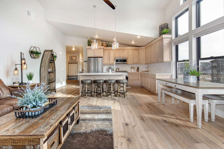 Mayflower Lakeside 303-14: Cozy sofa set, and dining table, with a glimpse of the kitchen. Mayflower Lakeside 303-14: Cozy sofa set, and dining table, with a glimpse of the kitchen.