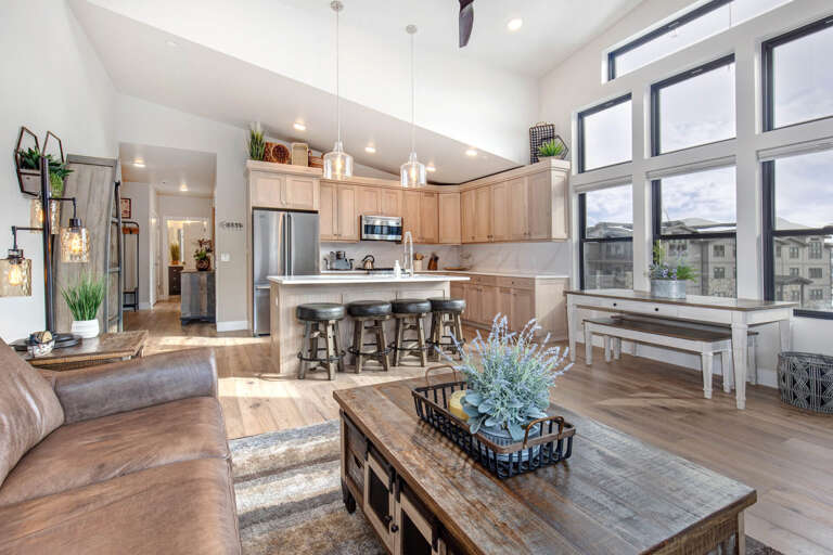 Mayflower Lakeside 303-14: Cozy sofa set, and dining table, with a glimpse of the kitchen. Mayflower Lakeside 303-14: Cozy sofa set, and dining table, with a glimpse of the kitchen.