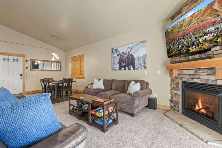 Bear Hollow 1404:  Cozy space with a sofa set, dining table, and fireplace. Bear Hollow 1404:  Cozy space with a sofa set, dining table, and fireplace.