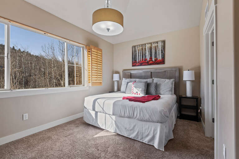 Bear Hollow 1404: Sunlight streaming through window onto cozy bed, inviting relaxation and rest. Bear Hollow 1404: Sunlight streaming through window onto cozy bed, inviting relaxation and rest.