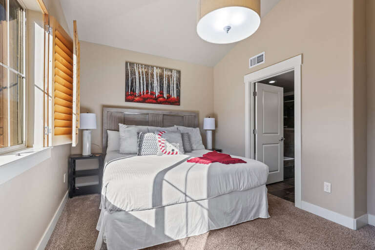 Bear Hollow 1404: Sunlight streaming through window onto cozy bed, inviting relaxation and rest. Bear Hollow 1404: Sunlight streaming through window onto cozy bed, inviting relaxation and rest.