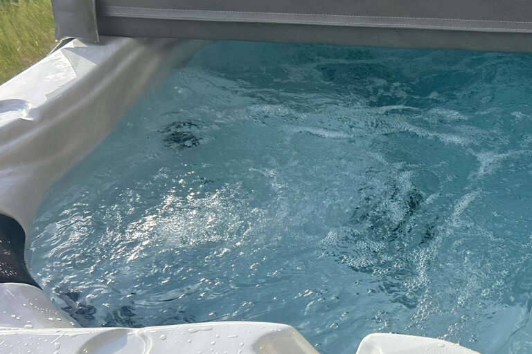 Slip into your private hot tub and let the warm, bubbling jets melt away tension as you unwind in complete comfort.
