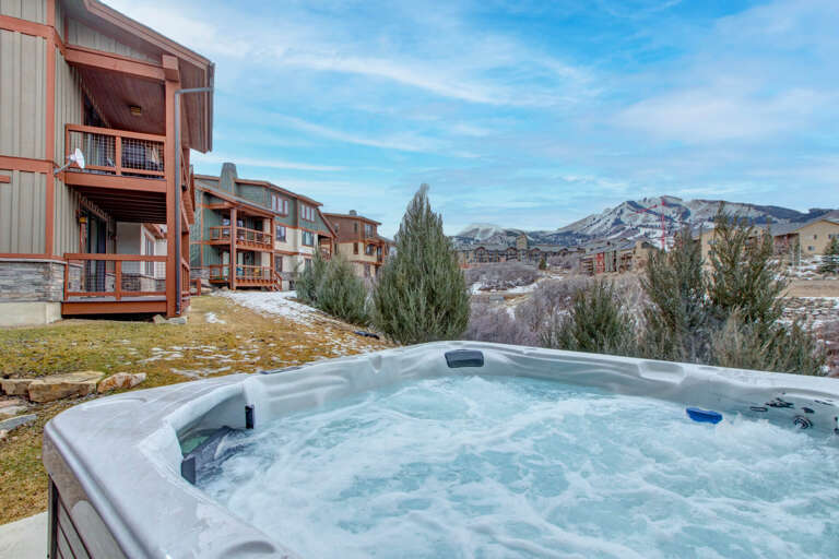 Soak in the bubbling hot tub while taking in breathtaking mountain views and crisp alpine air—your perfect retreat after a day of adventure.