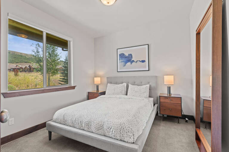 Wake up to mountain scenery and natural light streaming through your bedroom window, creating a peaceful and inviting space to start your day.