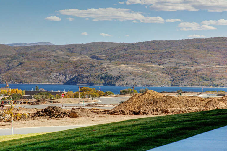 The property sits in a scenic lakeside location with panoramic views of rolling hills and tranquil blue waters, offering a peaceful natural setting for your stay.