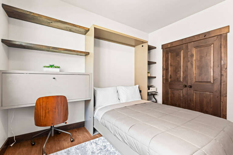 Black Rock Ridge 14544: Cozy bed by the window, perfect for a relaxing afternoon nap.