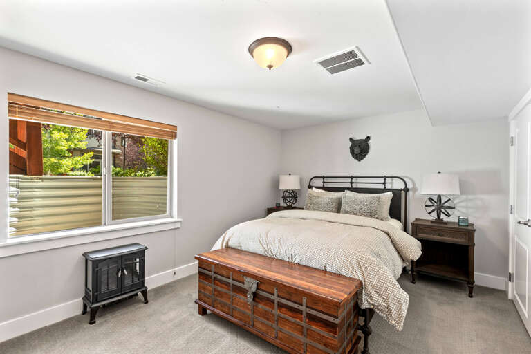 Unwind in your private bedroom, where soft linens and warm wood tones create a cozy retreat. Natural light filters through, and the quiet space invites restful nights and peaceful mornings.