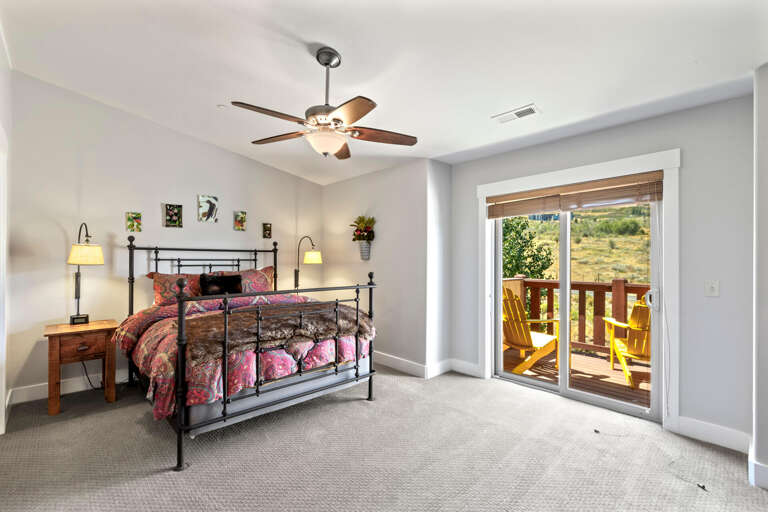 Bear Hollow Village 5667 by Moose Management: Upstairs primary bedroom with balcony and ensuite bathroom Bear Hollow Village 5667 by Moose Management: Upstairs primary bedroom with balcony and ensuite bathroom