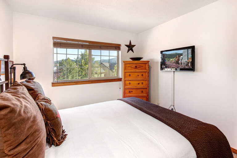 Wake up to beautiful mountain vistas framed by your bedroom window. Crisp linens, warm wood accents, and thoughtful décor create a peaceful retreat for restful nights.