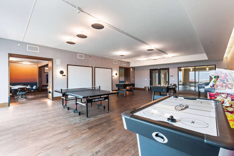 Challenge friends to your favorite games in this spacious recreation room, complete with ping pong, air hockey, foosball, and a pinball machine for endless entertainment.