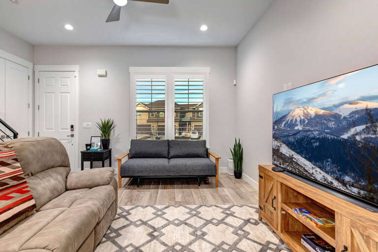 Wasatch Springs 1107: Living room with comfortable seating, smart TV and futon.