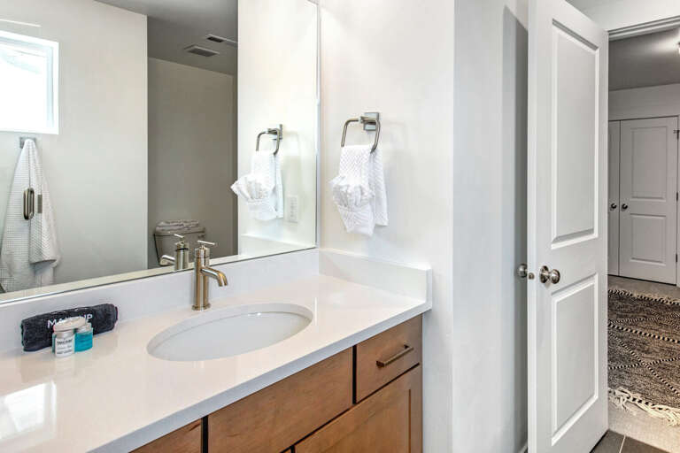 Your modern bathroom awaits with a sleek vanity, fresh towels, and contemporary fixtures—perfect for unwinding after a day of adventure.
