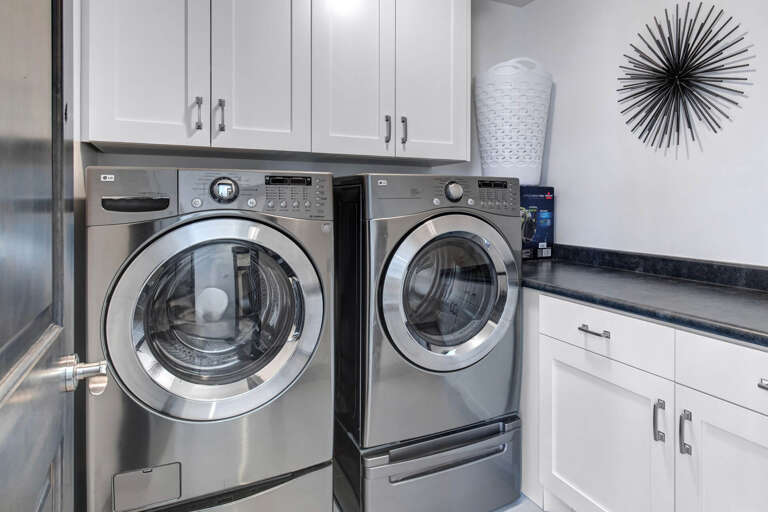Fresh, clean linens anytime you need them—your own dedicated laundry space with modern washer and dryer makes packing light a breeze.