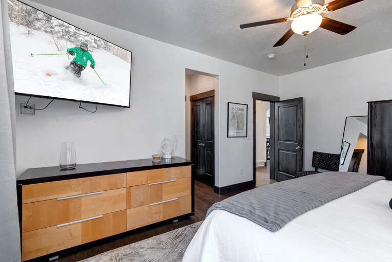 Retreat at Jordanelle 1157: Main level ensuite primary bedroom with King Bed and TV
