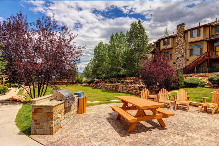 Gather around the picnic table or lounge in your Adirondack chair with mountain views framing your perfect outdoor retreat. Fire up the built-in grill and unwind in landscaped gardens.