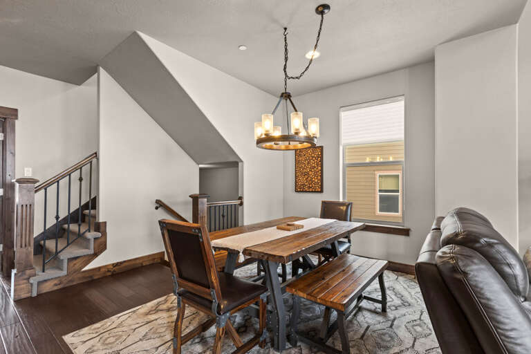 Retreat 13548: Formal dining table in this open concept living, kitchen and dining area.