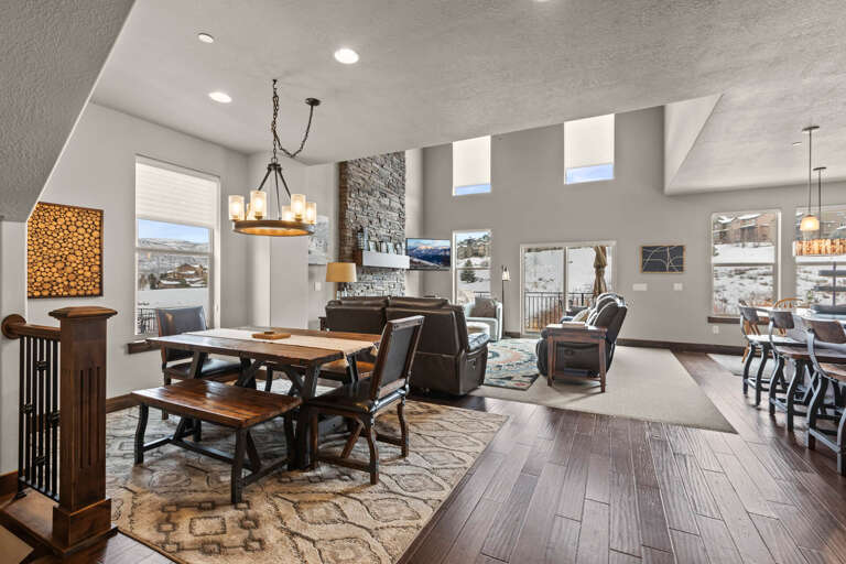 Retreat 13548: Formal dining table in this open concept living, kitchen and dining area.