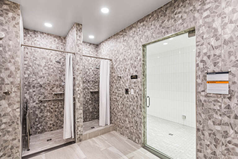 These accessible showers with grab bars and easy entry provide comfort and safety for all guests during your stay.