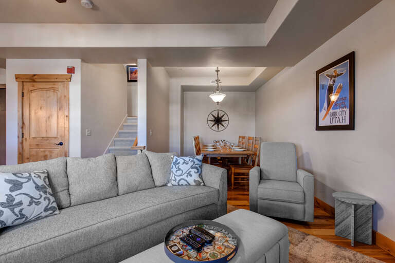 Unwind in your cozy living space with plush gray seating and warm wood accents that create the perfect retreat after your mountain adventures.