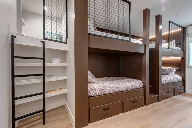 Upper Main 301: Sleep soundly in your custom bunk bed with built-in storage and privacy screens, perfect for families or groups.