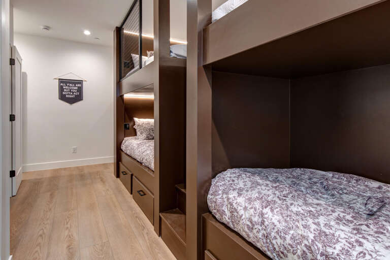 Upper Main 301: Your kids will love these custom bunk beds with cozy built-in lighting and under-bed storage drawers.