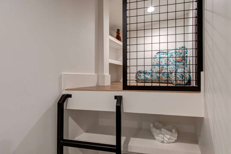 Upper Main 301: Your cozy reading nook awaits with built-in shelves and warm wood accents, perfect for unwinding with a book.