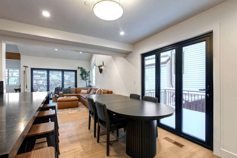 Gather around your stylish dining table while natural light fills this modern space, creating perfect moments for memorable meals together.