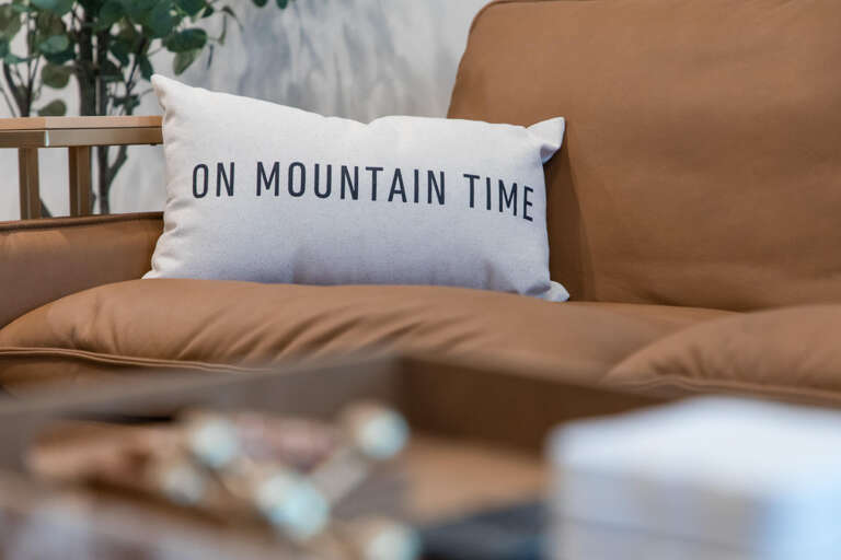Sink into this cozy seating area where you can truly embrace 'mountain time' and let your worries melt away.