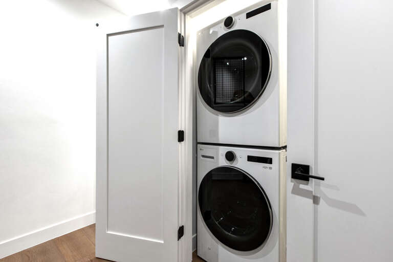 Tucked into your private closet, a stacked washer and dryer let you refresh your wardrobe anytime—no leaving the suite, no shared facilities. Just easy convenience at your fingertips.
